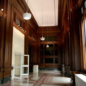 Springer Cultural Center Historic Lobby: Decorative dark wood paneling cover walls with marble flooring.