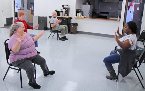 A chair fitness class for senior citizens.