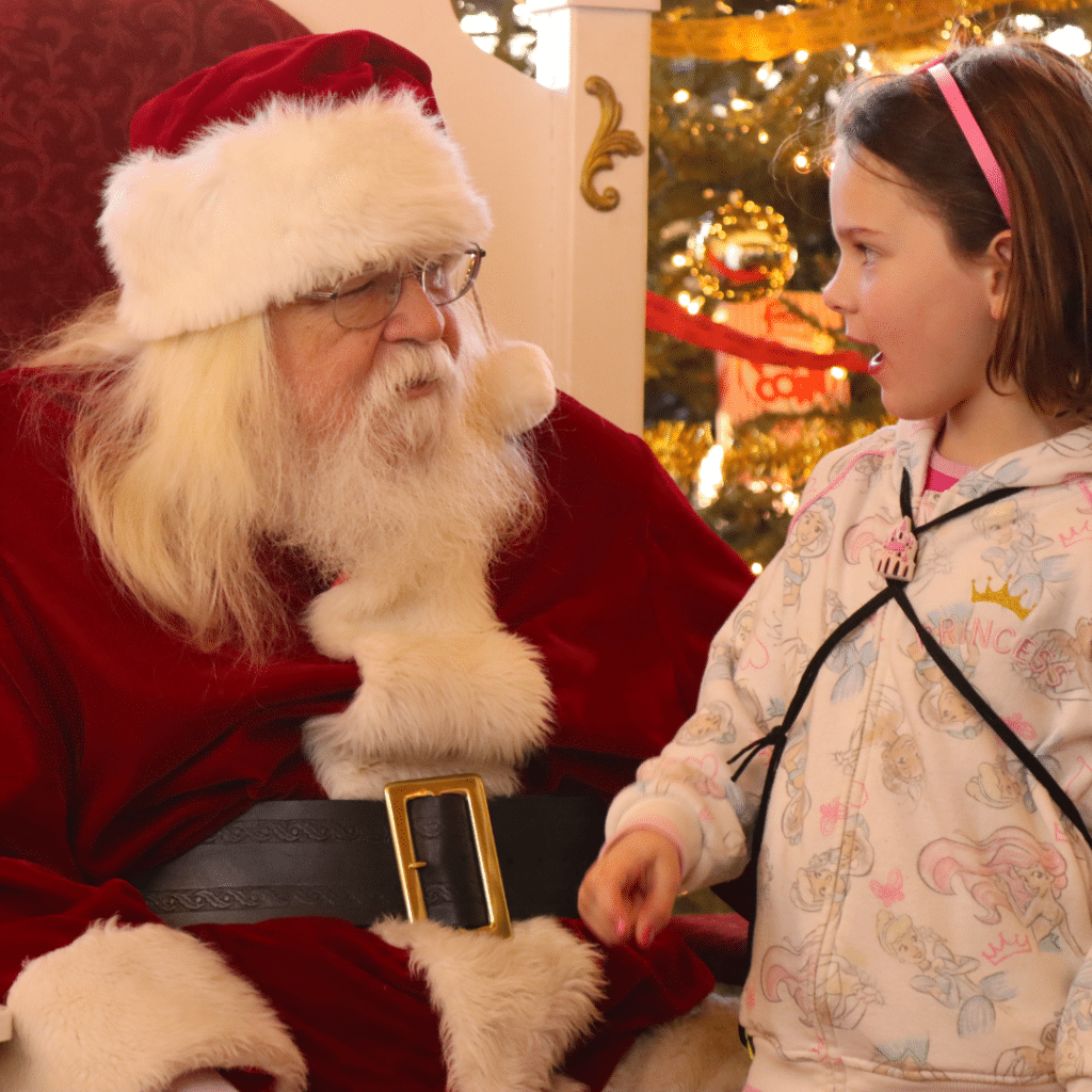 A young child visiting Santa