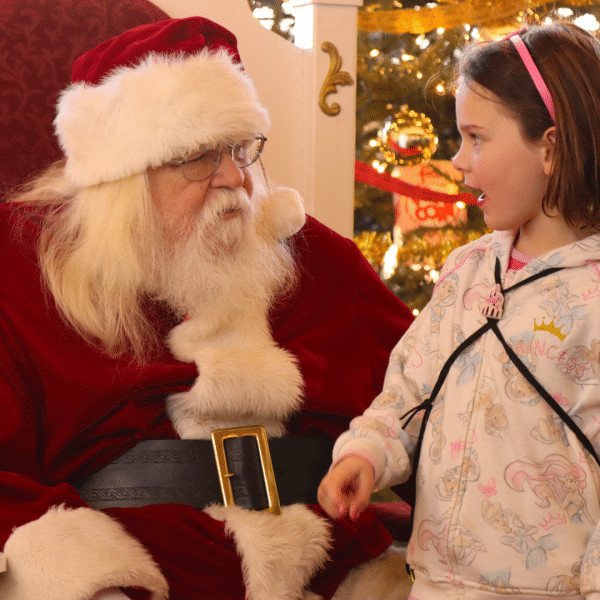 A young child visiting Santa